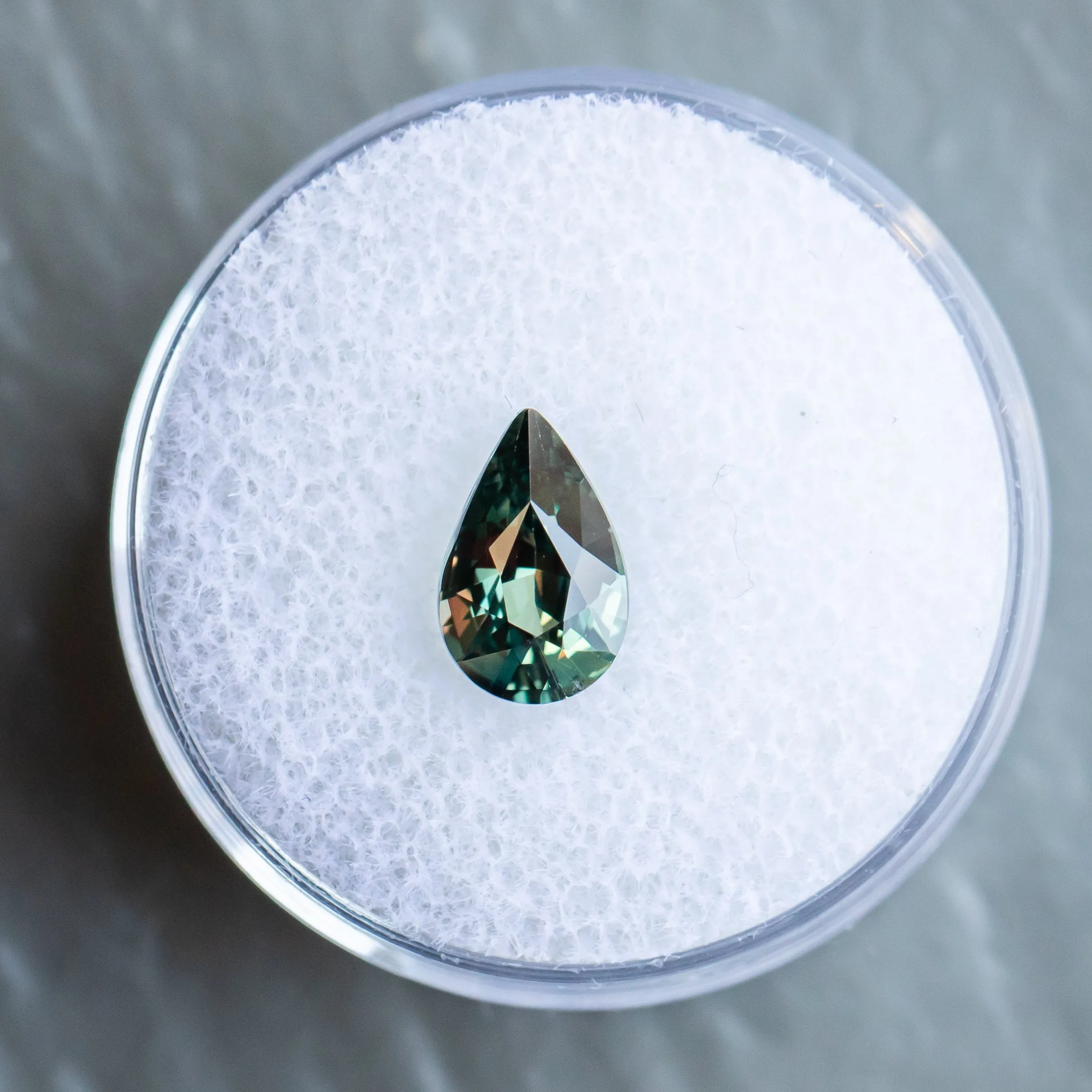 1.67CT PEAR TANZANIAN SAPPHIRE, COLOR SHIFTING FROM MERLOT PURPLE TO TEAL, 9.23X5.97X4.18MM