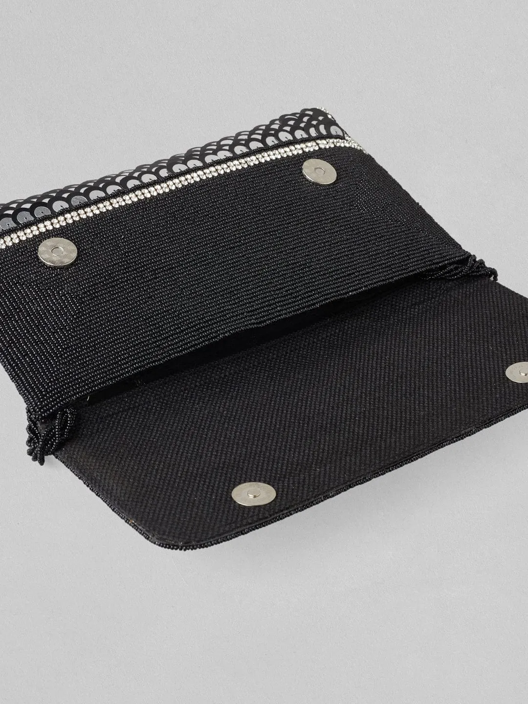 Rubans Silver Colour Clutch With Black Embroided Design.